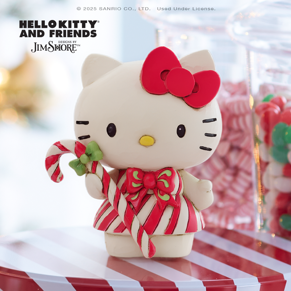 Hello Kitty figurine with a candy cane in a festive setting, featuring Sanrio and Jim Shore logos.