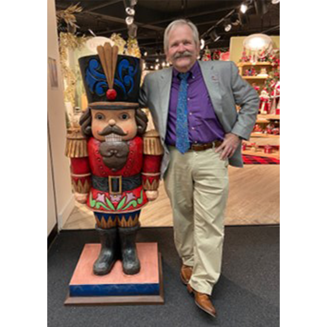 Jim standing next to Nutcracker statue