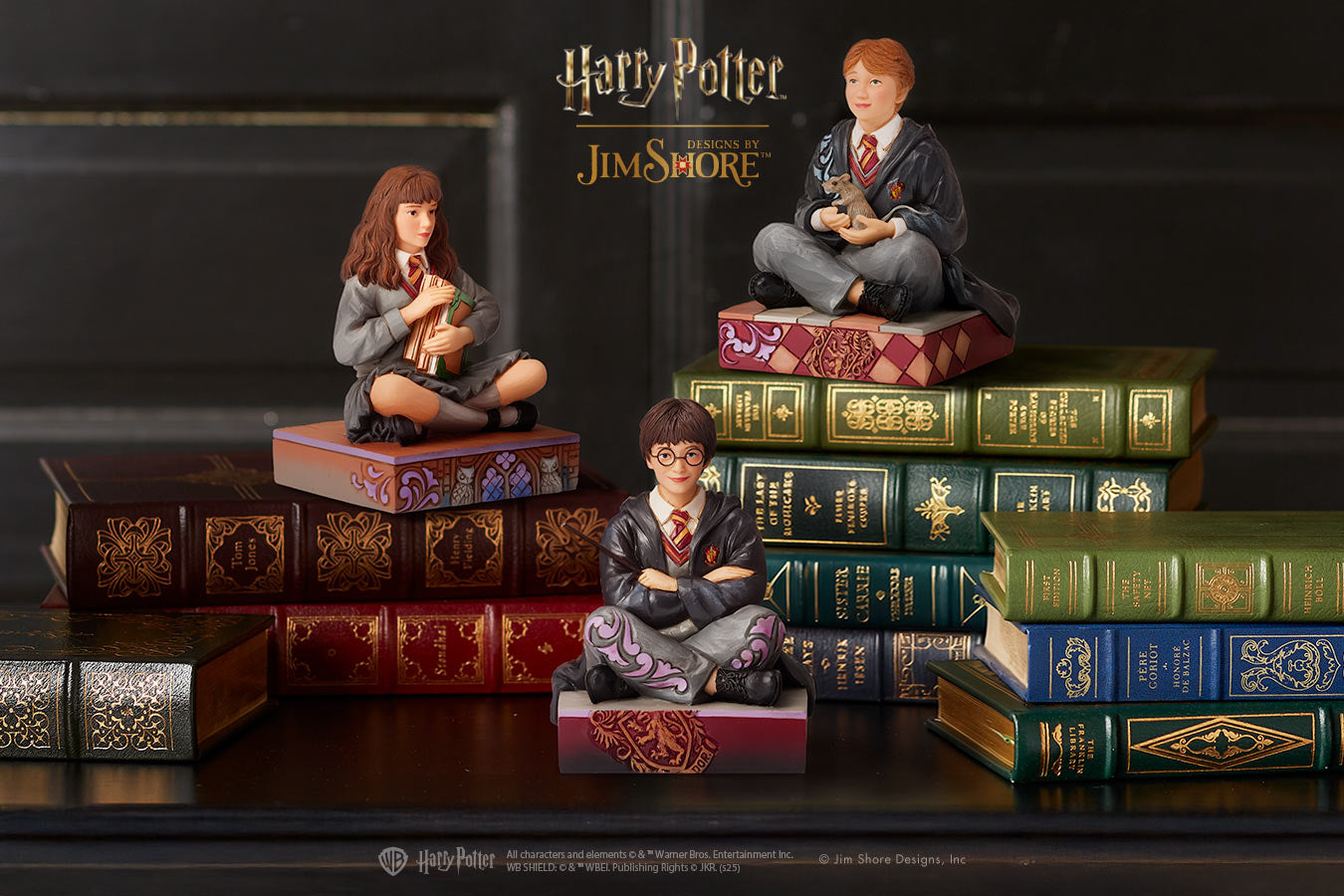 Figurines of Harry Potter and friends on books with 'Harry Potter' branding.
