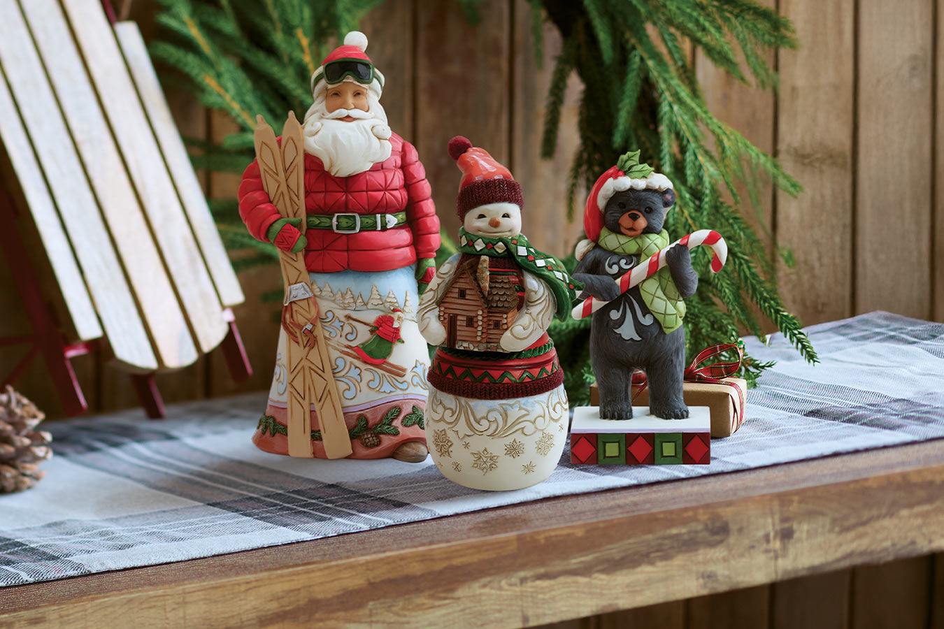 Decorative Christmas figurines on a table with a wooden background