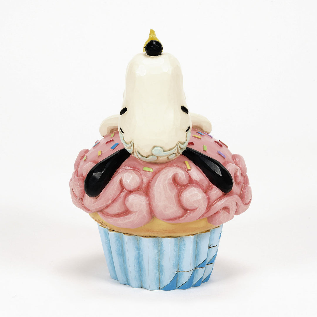 Snoopy Laying on Cupcake