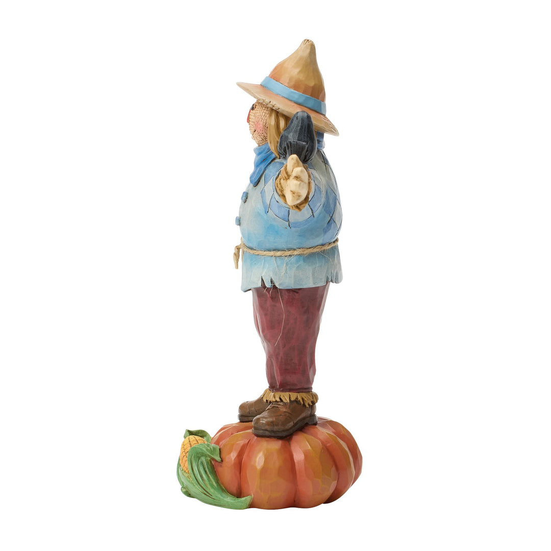 Scarecrow Standing on Pumpkin