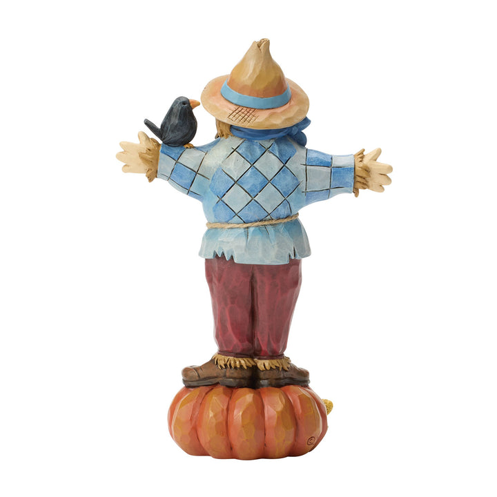 Scarecrow Standing on Pumpkin