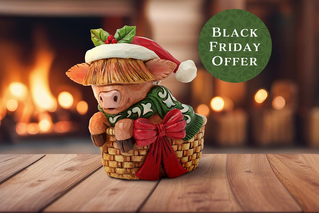 Decorative pig figurine with a basket, Santa hat, and holly leaves in front of a fireplace with 'Black Friday Offer' text.