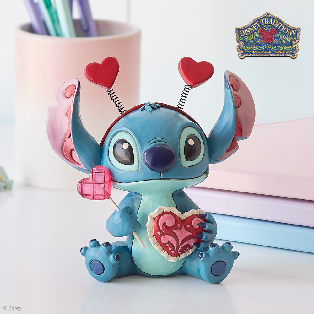 Valentine-themed Stitch figurine with heart decorations on a light background
