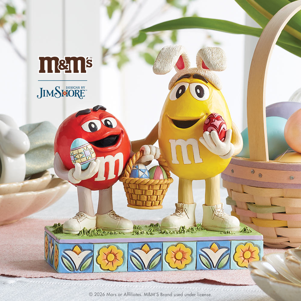 Two M&M figurines with Easter baskets and eggs on a decorative base, featuring the M&M's and Jim Shore logos.