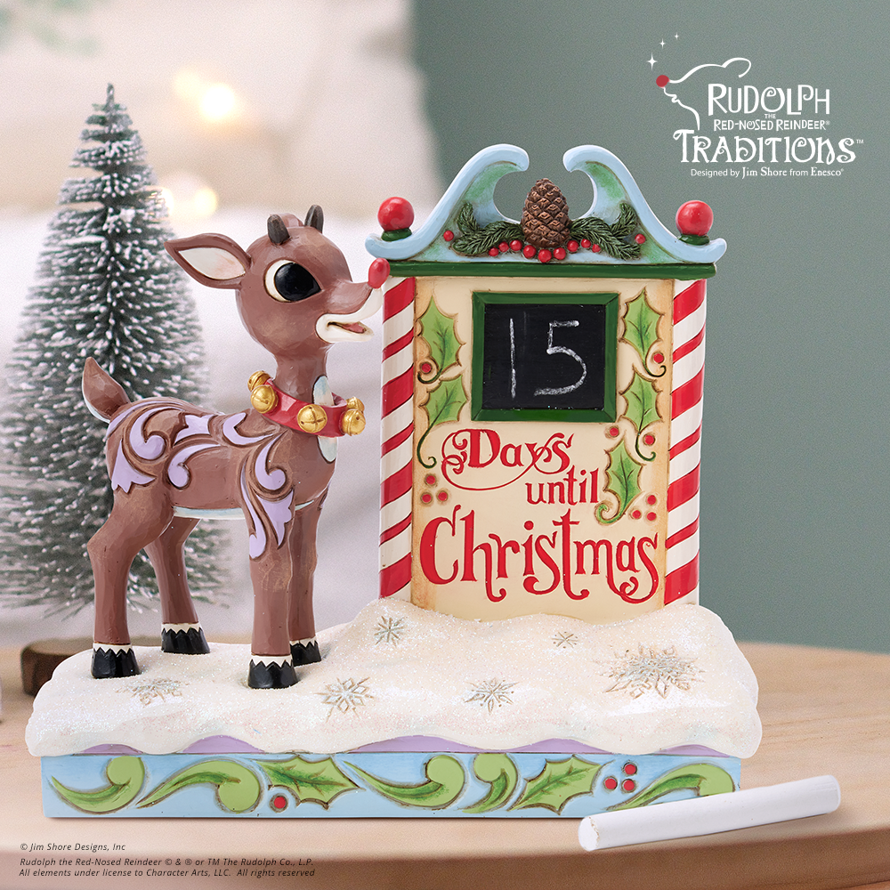 Christmas-themed figurine with a reindeer and a countdown calendar, featuring Rudolph the Red-Nosed Reindeer Traditions.